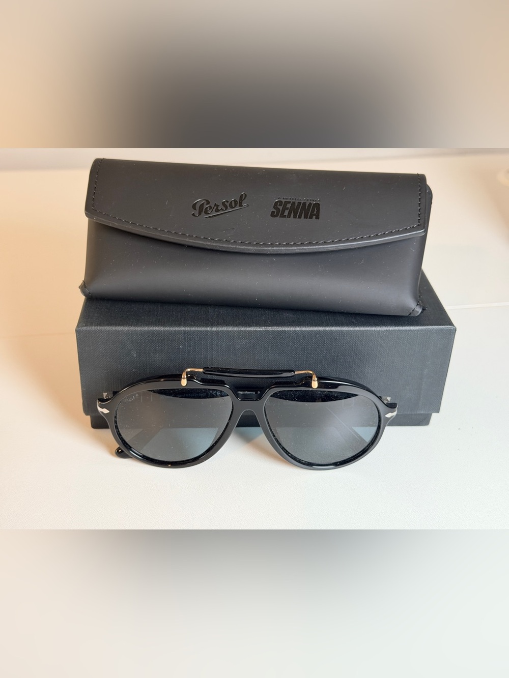 Persol Polarized Sienna Black Sunglasses with Gold Accents and Dark Lenses